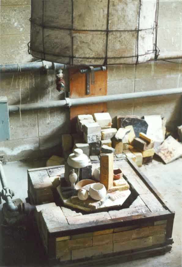 Raku kiln fully loaded and ready for firing. Notice how the glazed pottery is not overextending the firing area within the kiln